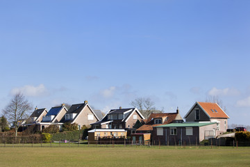 Dike houses in Dutch polder landscape