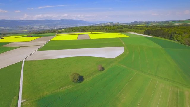 4K Countryside in spring time aerial shot. Central europe - french speaking part of Switzerland