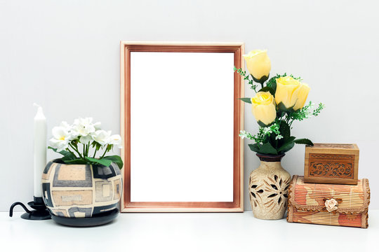 A4 wooden frame mockup with flowers and boxes