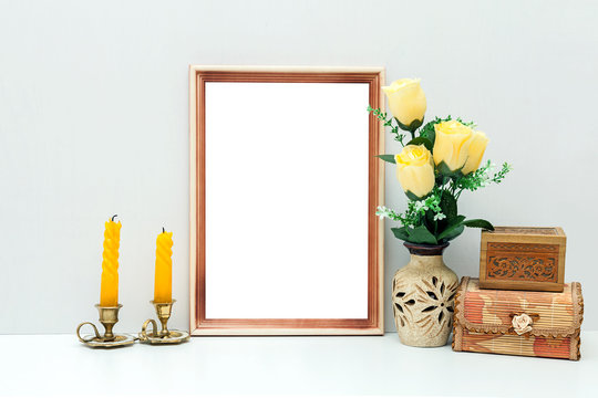 A4 wooden frame mockup with yellow flowers and boxes