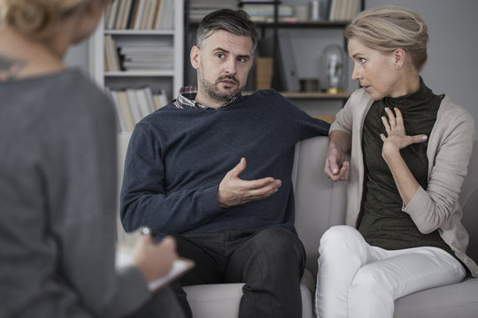 Quarreling couple with therapist