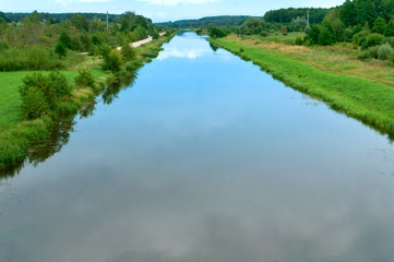 Fototapeta na wymiar Lake or fishing pond. Landscape a beautiful pond. Forest natural pond