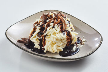 Spaghetti ice cream with chocolate topping