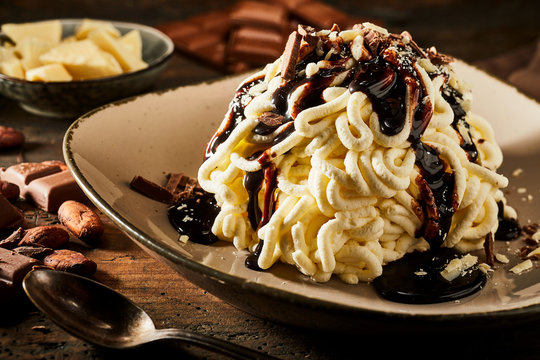 Spaghetti ice cream dessert with chocolate sauce