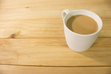 Fototapeta na wymiar Coffee cup on wooden background.