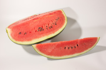 Watermelon and sliced of watermelon on white background.