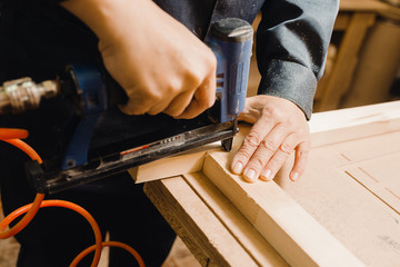 Worker assembles the base of the door