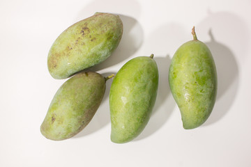 Group of raw mango on white background.