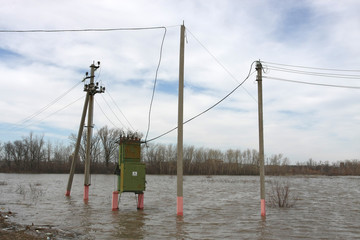 Transformer in flood. Danger of water and electricity.