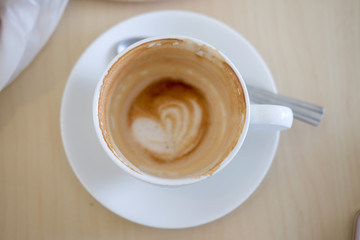 Empty coffee cup after drink on wood table