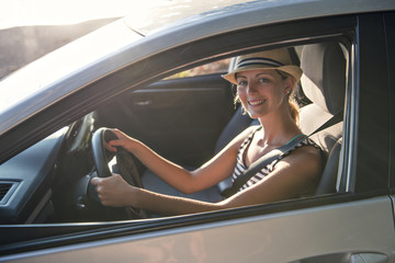 woman sitting in a rental car on holiday vacancy