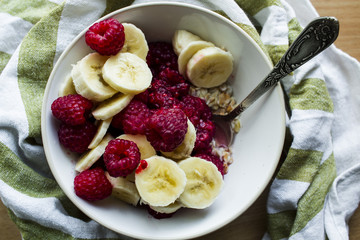 healthy breakfast from raspberry, banana and porridge