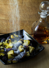 dynamic photo of plums in sugar and rum