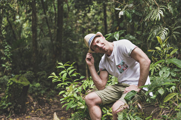 A men in jungle with hat