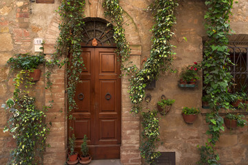Traditional facade of Italian house in the old village of Pienza