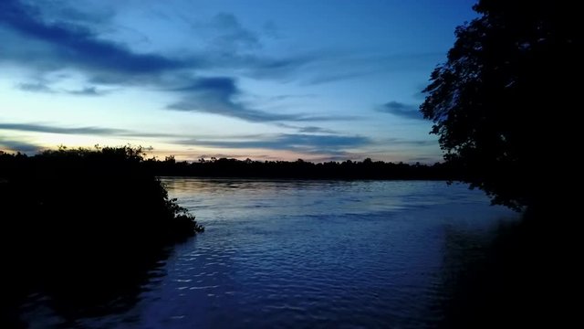 Drone footage of lake during beautiful sunset
