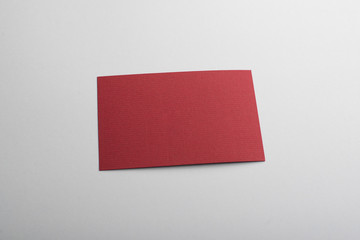 Red card on gray background. Mockup.