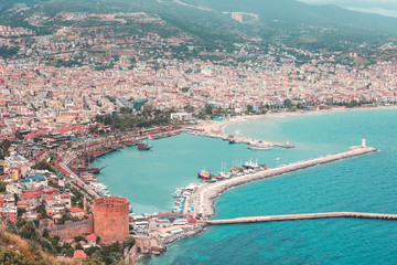 Fototapeta na wymiar Red Tower in Alanya, Turkey. View on city, bay, ships, beach and Mediterranean Sea