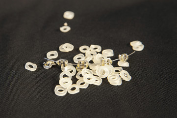 Dental concept. Metal braces and elastic bands for braces on black background. Copy space