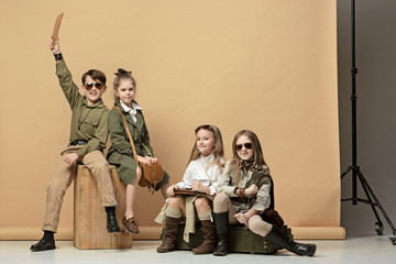 Fototapeta premium The group of beautiful girls and boys on a pastel background