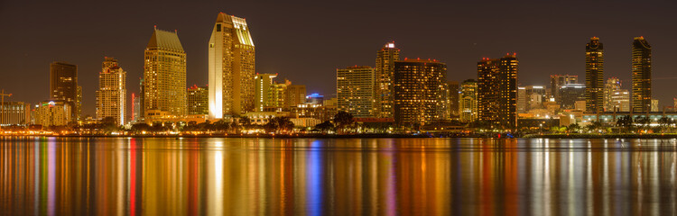 Fototapeta na wymiar San Diego at Night - A panoramic night view of waterfront skyline of San Diego Downtown at San Diego Bay, looking from Coronado Peninsula, San Diego, California, USA.