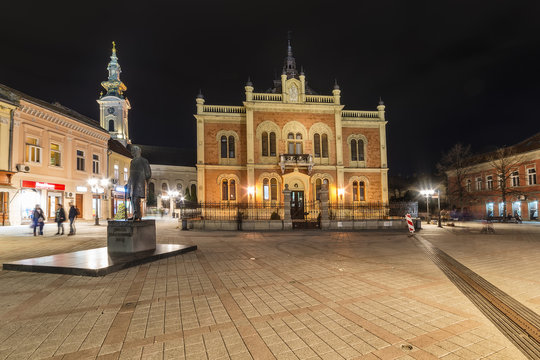 Novi Sad, Serbia March 14, 2018: Center of Novi Sad in Zmaj Jovina street with Vladicin court residential palace, Orthodox church and monument of Jovan Jovanovic Zmaj.