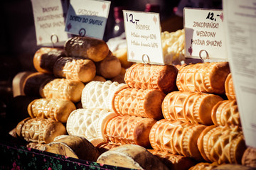 Traditional polish smoked cheese oscypek on outdoor market in Zakopane