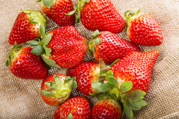 red ripe strawberries close up in the detail
