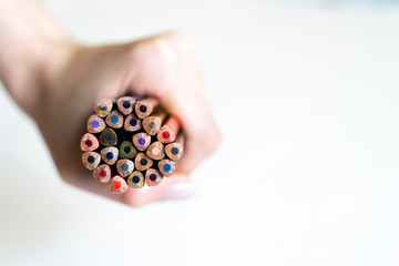 a lot of pencils in the hands