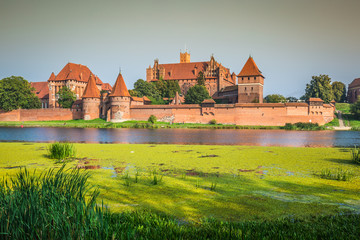 Naklejka na ściany i meble Malbork Castle at Nogat River in Poland, Europe