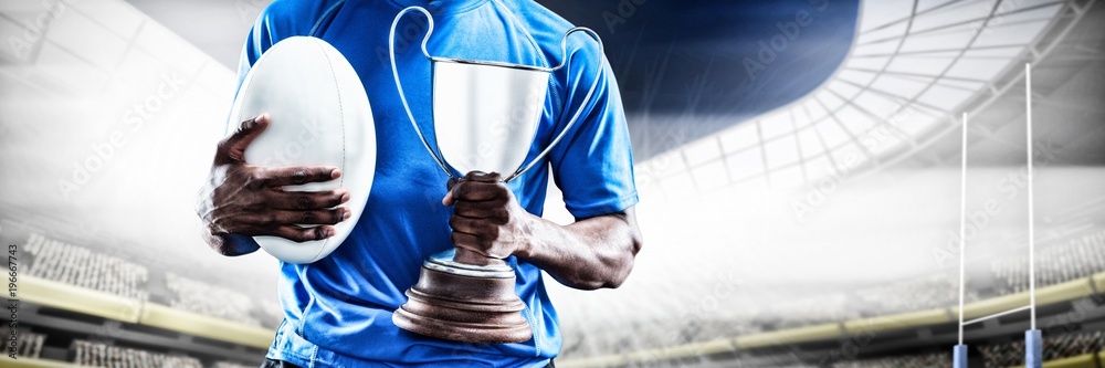 Poster Composite image of mid section of sportsman holding trophy and