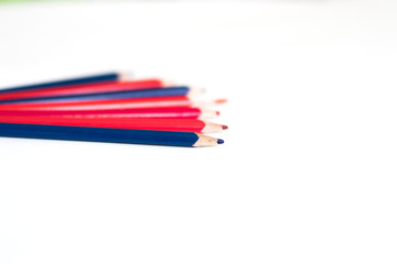 colored pencils lying on white