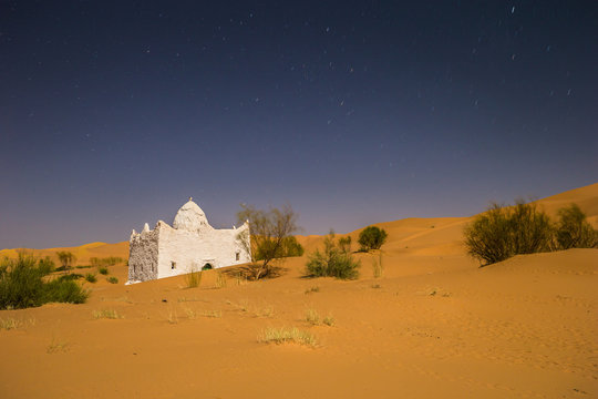 Tahgit - June 06, 2017: Old small house at night near the town of Taghit, Algeria