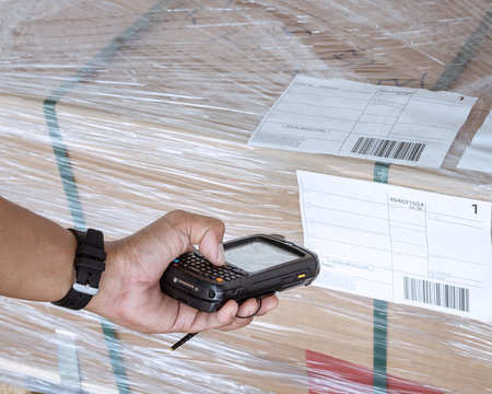 Workers Scanning Bar Code Scanner on Label Cargo Shipping. Warehouse Inventory Management. Storehouse. Shipment Customers Service.