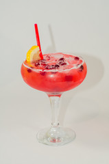 red alcoholic drink with ice on white background