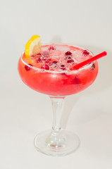 red alcoholic drink with ice on white background