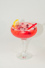 red alcoholic drink with ice on white background
