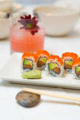 Tray of maki sushi with avocado, salmon and caviar