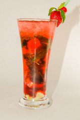 red alcoholic drink with ice on white background