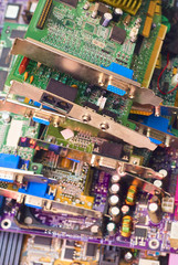 Stack of old computer cards. Piles of obsolete hardware and electronic components. Computer hardware ready for recycling

