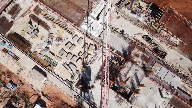 Construction site during work hours - Top down aerial footage