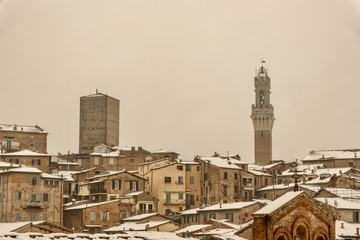 View of Siena in winter during a snowfall
