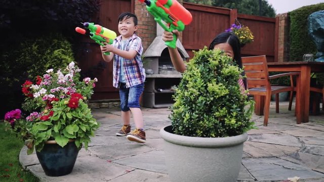 Having a Water Fight in the Garden