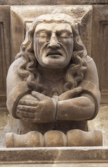 Ancient corbel, located under balconies of city hall, represent different aspects of characters medieval era, Cervera, province Lleida, Catalonia.Spain.