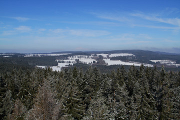 Beautiful winter landscape with intense blue sky and some clouds over picturesque snow formations...