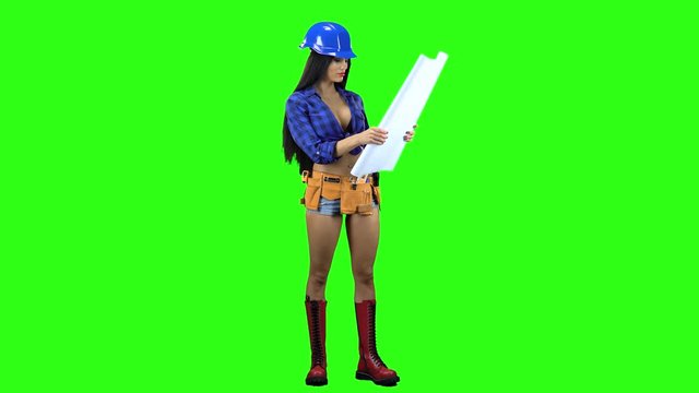 Girl in a helmet and shorts unwraps the paper with a drawing on a green background