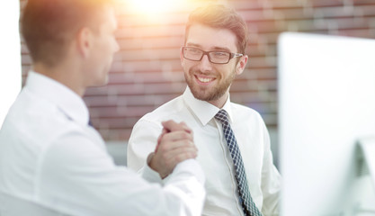 handshake Manager and customer in a modern office