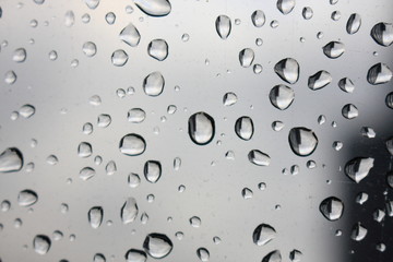 Rain drops on the glass. Close-up of drops