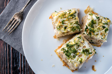 Fish pie with a dough, egg and fresh herbs
