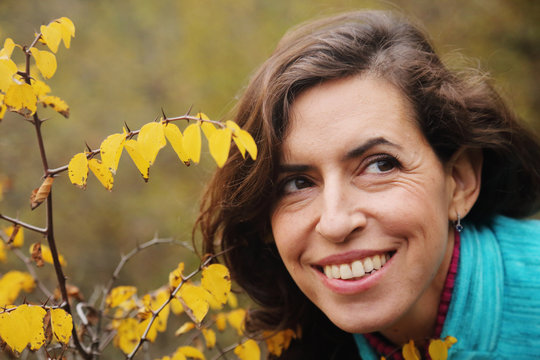 Outdoor Portrait Of Happy 40 Years Old Woman